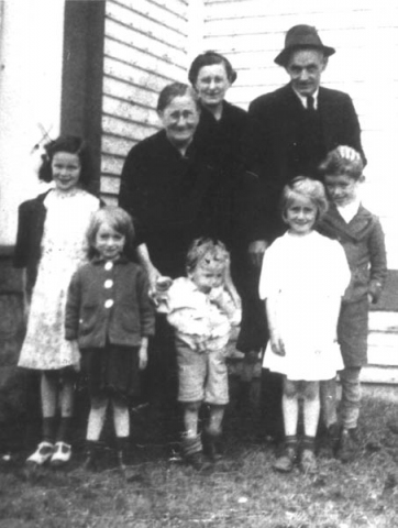 177: Adults John Carroll, his wife Eliz Reddy, and their daughter Min (Carroll) Ennis;  children l-r Gwen Carroll, Nora Ennis, ? Carroll, Mary Ennis and Bill Ennis.  (circa 1944) [courtesy of Rita (Ennis) Clowe]  - Gwen and ? children of Michael Carroll &amp;amp; Josie Barry